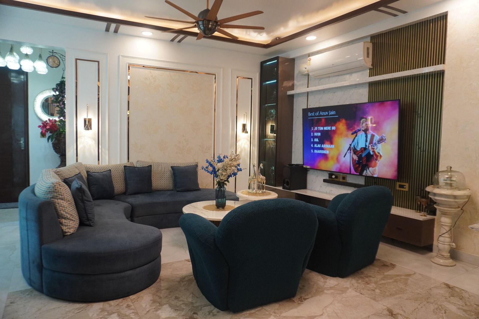 Luxury living room interior with modern sofa, TV unit, and elegant decor
